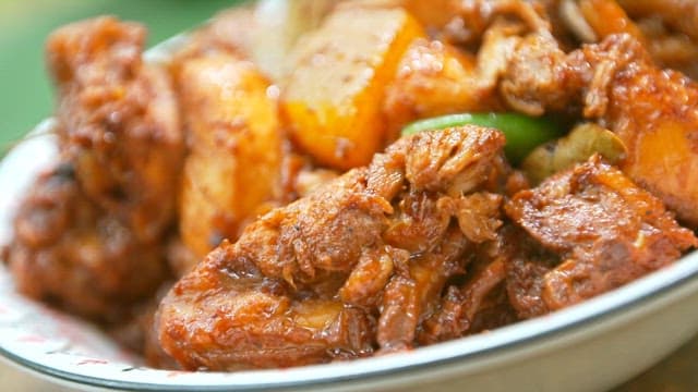 Chicken abodo with potatoes and peppers