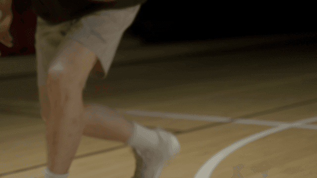 Person dribbling basketball