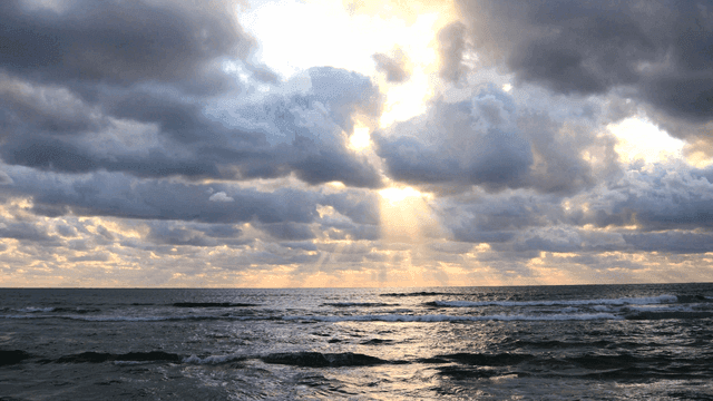 Cloudy sky over a calm ocean