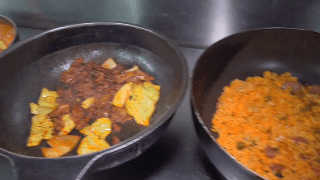 Various dishes cooking on a stove