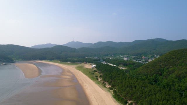 Scenic View of Coastal Town with Mountains