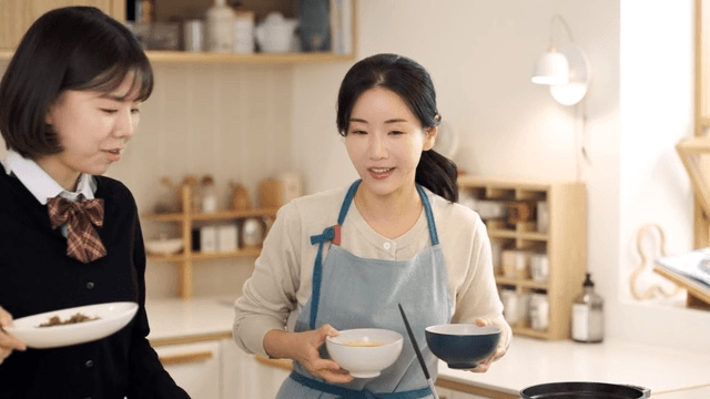 Mother and daughter preparing meal in cozy kitchen