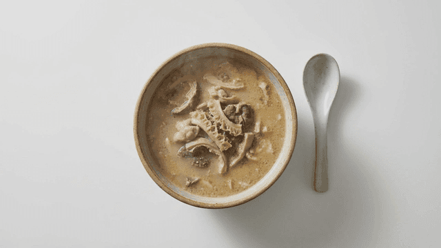 Steaming bowl of nourishing lamb bone soup
