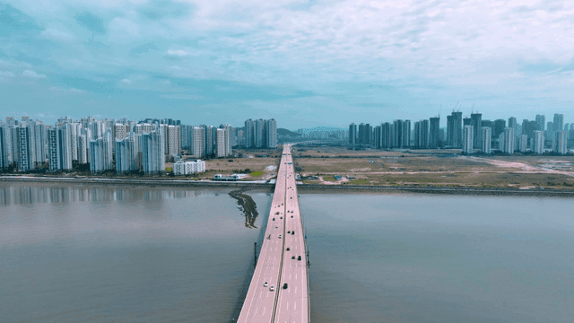 Bridge leading to city skyline