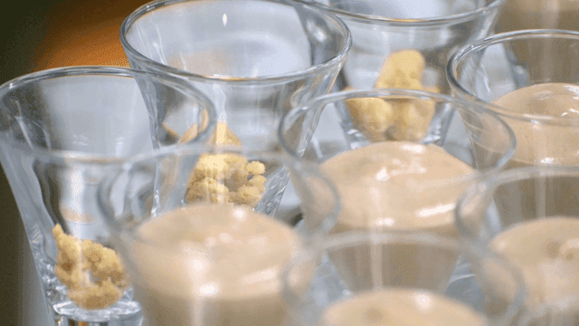 Cream poured into glass cup