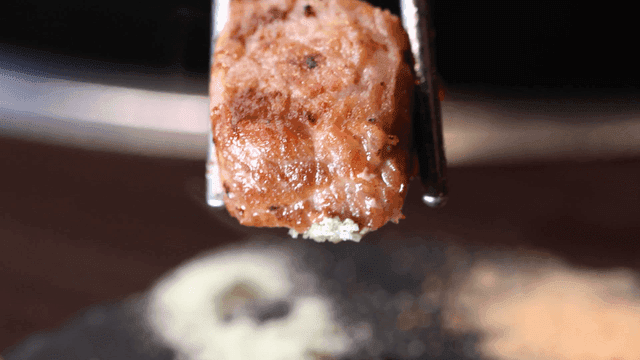 Grilled meat pieces dipped in salt