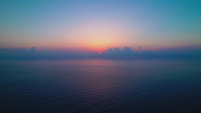 Sunset over a calm ocean