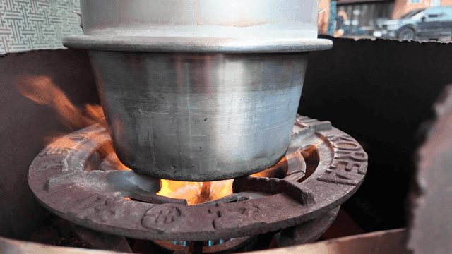Pot boiling over strong gas stove flames