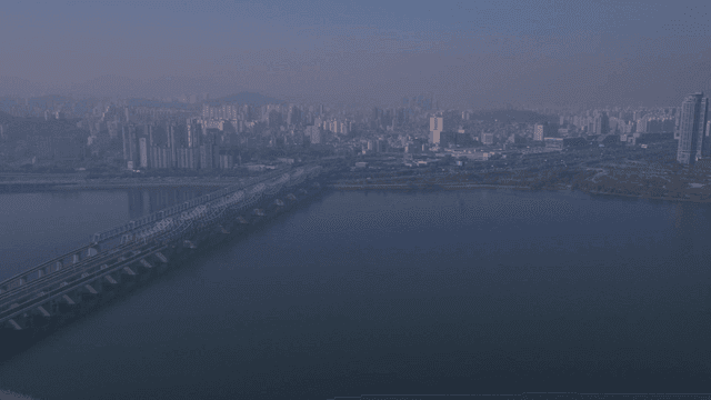 City skyline with a river and bridge