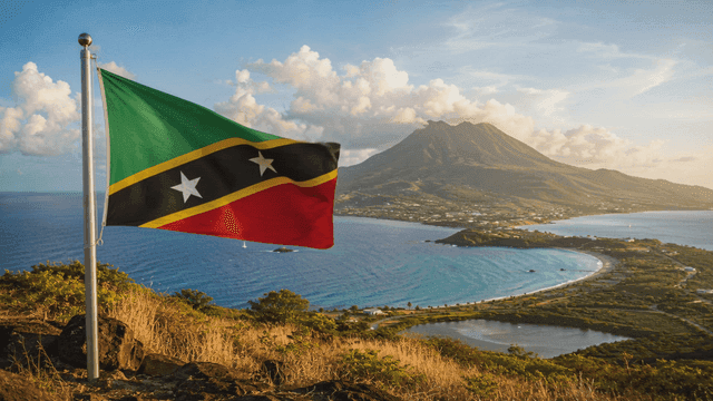 Saint Kitts and Nevis flag against coastal landscape