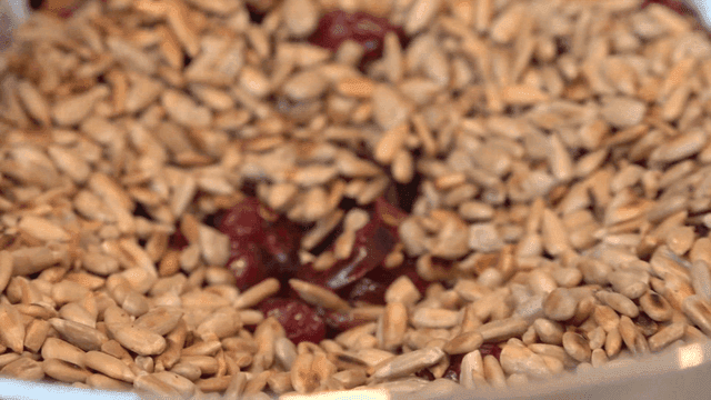 Mixing nuts and dried fruits with spatula