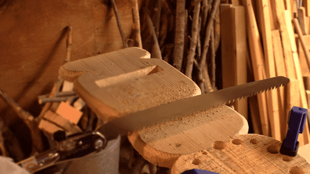 Wood being cut with a saw in a workshop