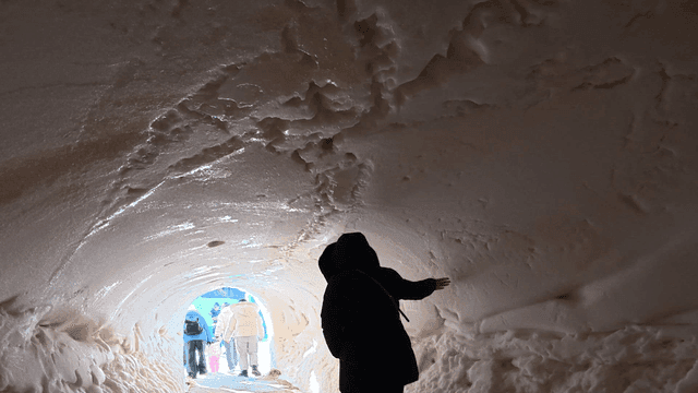 Walking through a snow tunnel