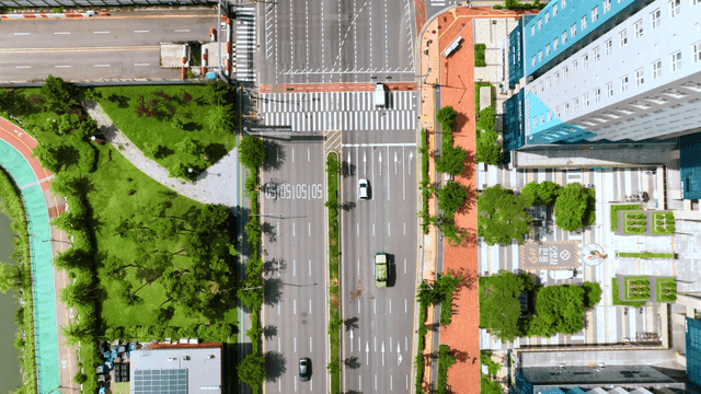 Aerial view of a city intersection with cars
