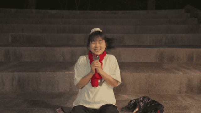 Girl dancing happily while holding an ice cream