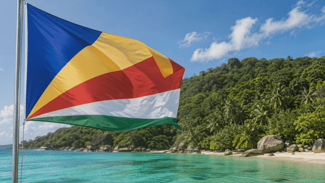 Seychelles flags fluttering on tropical beach
