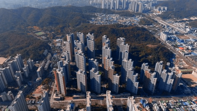 High-rise apartments surrounded by mountains