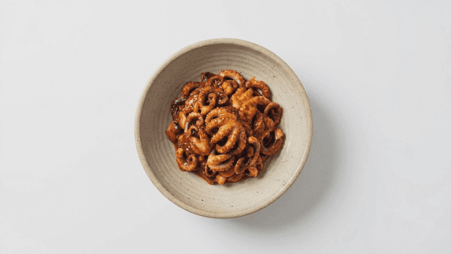 Spicy stir-fried octopus in a bowl