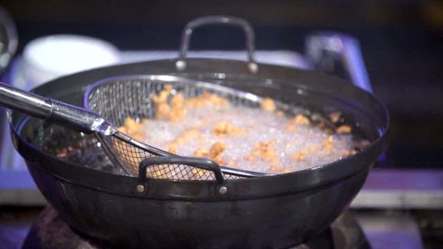 Fried pork taken out of hot oil