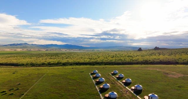 Vast landscape with traditional yurts