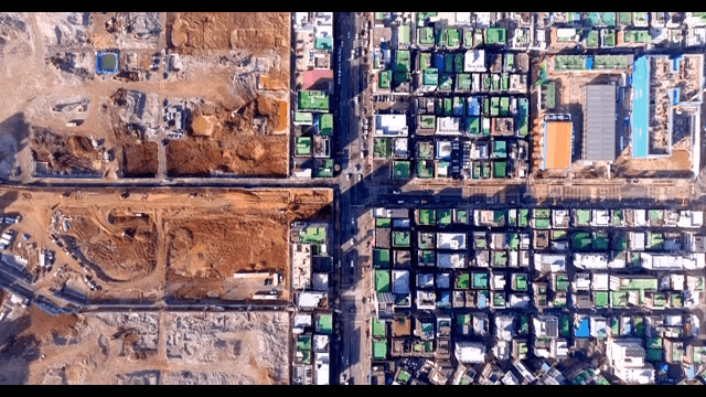 Cityscape with construction site and buildings