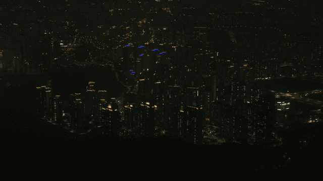 Bustling city landscape illuminated by lights at night