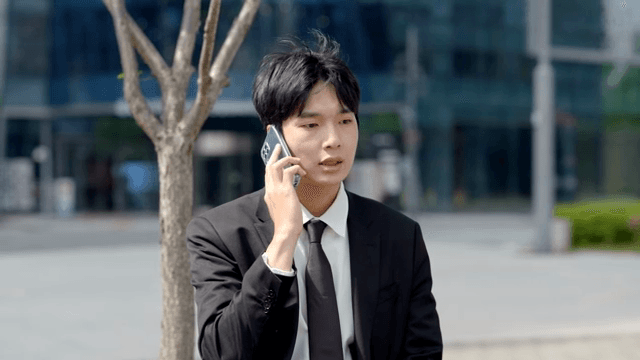 Nervous office worker talking on phone outdoors