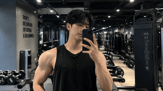 Man taking a selfie in a gym