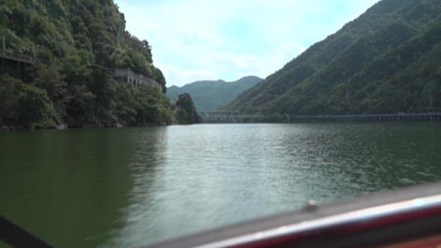 Serene Lake and Hills Seen from Boat