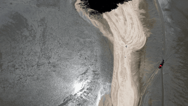 Aerial view of a sandy beach and island
