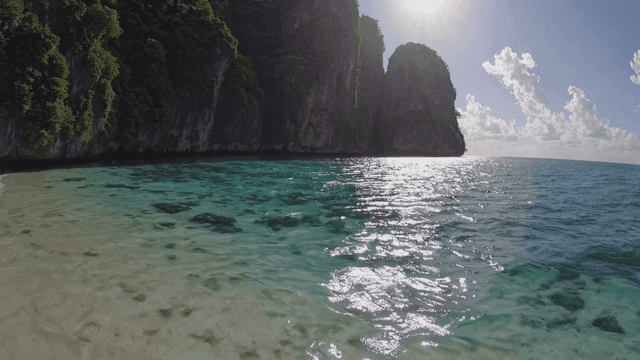 Quiet beach with clear blue water