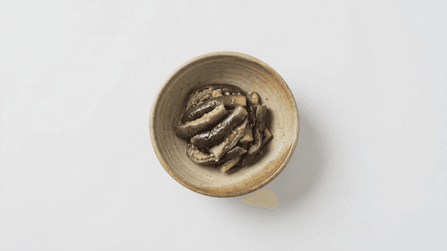 Seasoned eggplant served in ceramic bowl