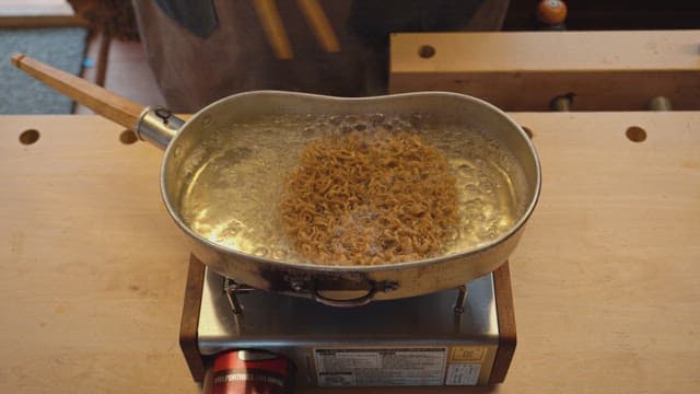 Cooking ramen noodles in a pot