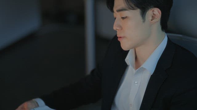 Man in a suit working at a desk