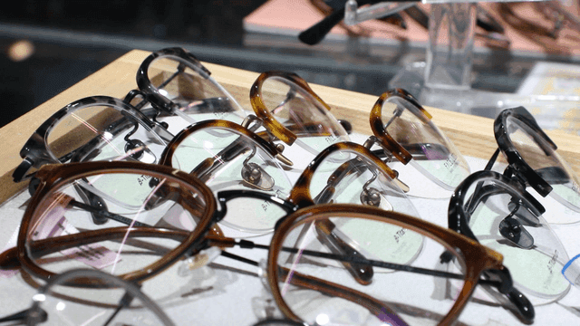 Various eyeglasses displayed on a tray