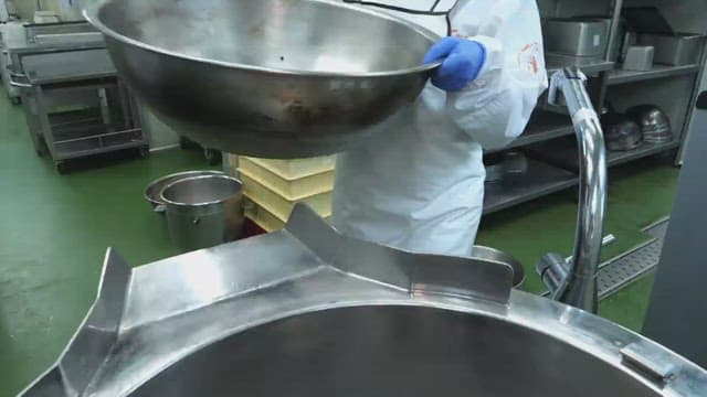 Red beans going into the washing machine of factory