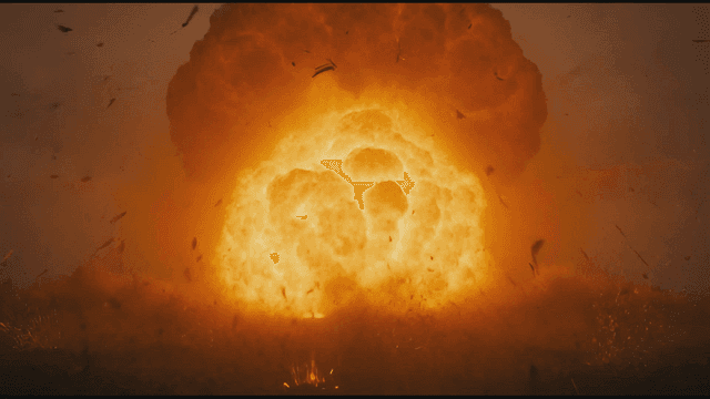 Massive explosion in desolate landscape.