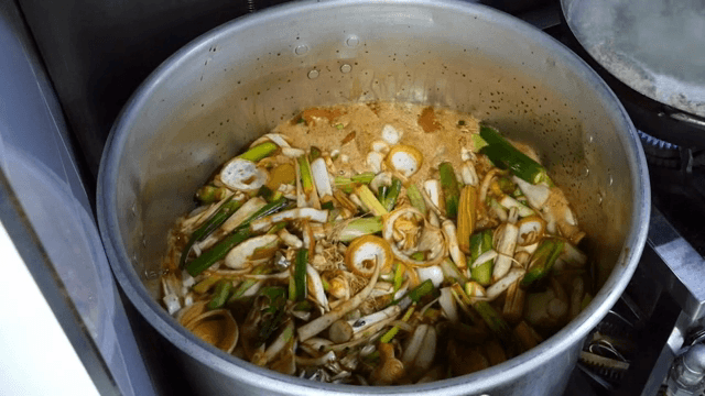 Stew full of vegetables boiling in a pot