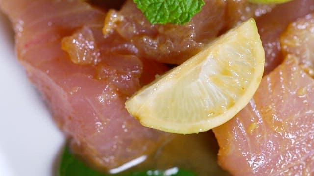 Fresh tuna with lemon and mint leaves