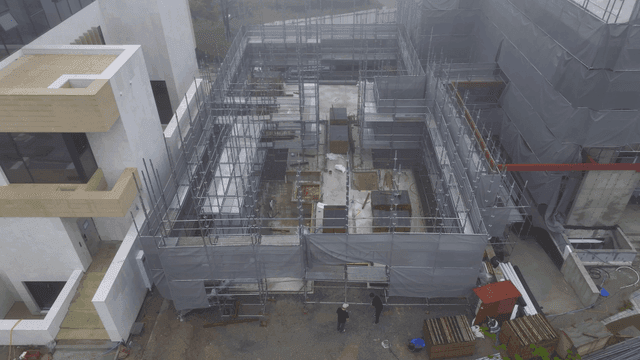 Construction site with scaffolding and workers