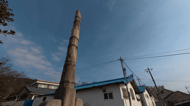 Stone pillars in quiet residential area under sunlight