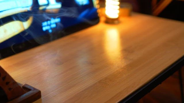 Bowl of skewers arranged on a plate in a wooden table with warm lighting