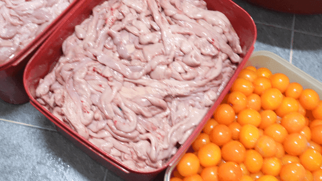 Container holding chicken offal and eggs
