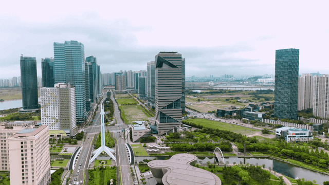 Modern cityscape with skyscrapers and greenery