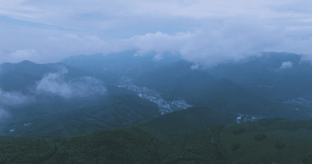 Serene mountain landscape shrouded in clouds