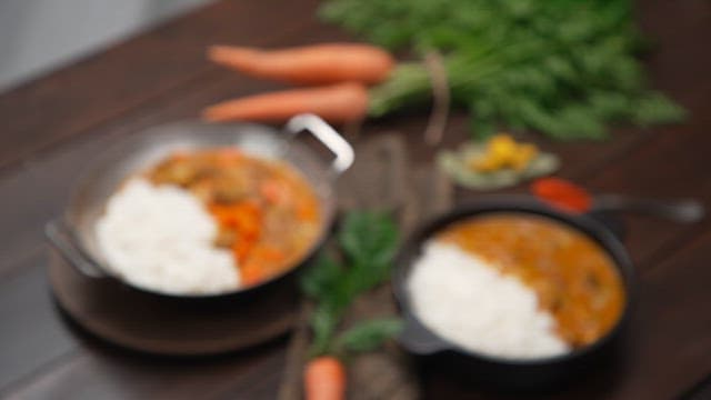 Curry Rice with Plenty of Carrots Served on the Table