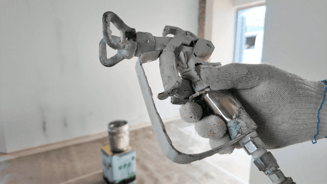 Paint spray gun at a painting site