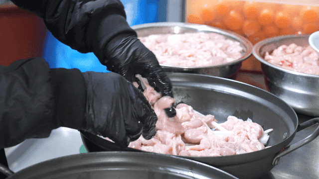 Raw chicken offal placed on top of pan