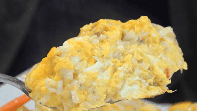 Moist steamed egg with ice fish scooped by ladle