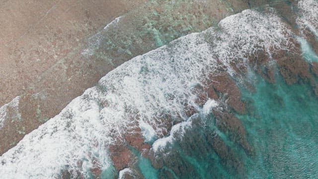 Waves crashing on a sandy beach